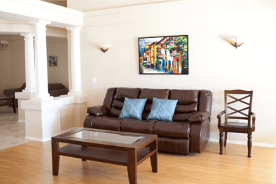 Cozy interior lounge area with seating and artwork