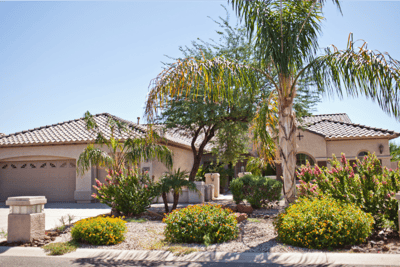 Exterior view of a residential assisted living facility with landscaping
