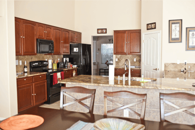 Spacious kitchen with modern appliances and cabinetry