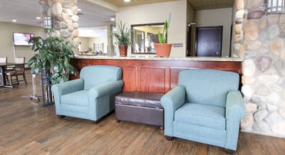 Common area with comfortable seating and plants