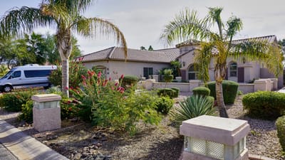 Exterior view of Legacy Assisted Living Home with landscaping