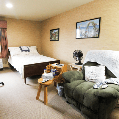 Cozy resident room with bed and seating area