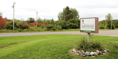 Sign for Lakewood Assisted Living with colorful landscaping
