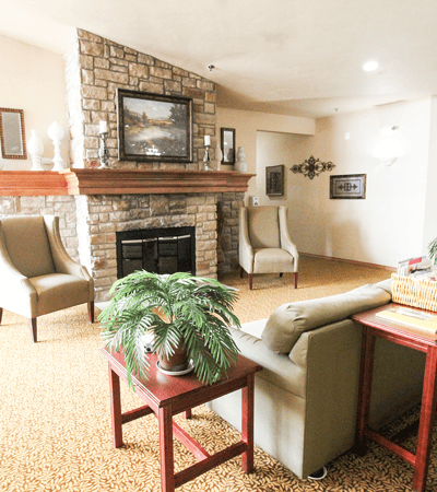 Cozy common area with seating and a fireplace