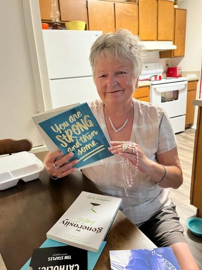 Resident engaging with books in a cozy interior setting