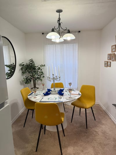 Cozy dining room setup with yellow chairs