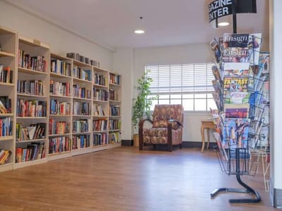 Interior common area with bookshelves and seating