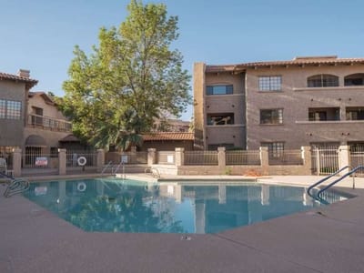 Swimming pool area with surrounding buildings