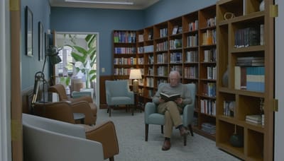 A resident reading in a cozy library area