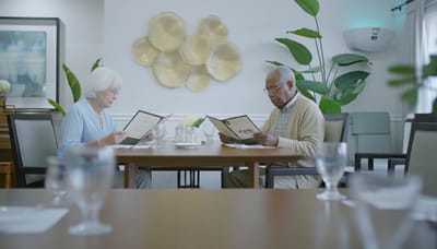 Residents reading menus in a dining room