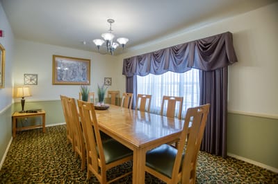 Dining room with a large table and natural light