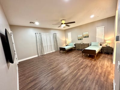 A well-furnished resident room with two beds