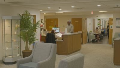 Interior view of a welcoming lobby with residents and staff
