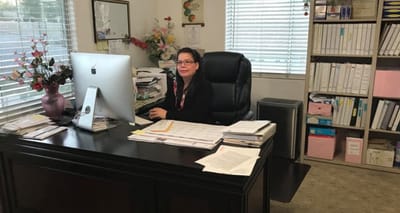 Staff member at a desk in the office