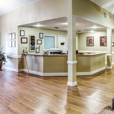 Interior common area with wood flooring and reception desk