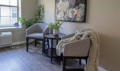 Cozy seating area with two chairs and a table
