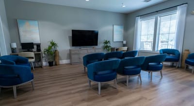 Bright common area with seating for residents
