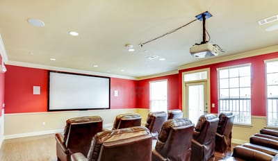 Campanile on Justice Park, independent living in Houston, TX — Home theater with comfortable seating and large screen