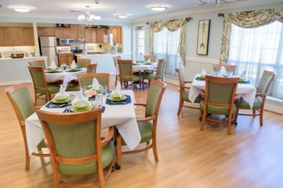 Dining area with neatly set tables and chairs