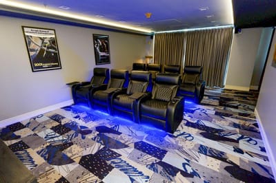 Interior of a cozy movie room with reclining chairs