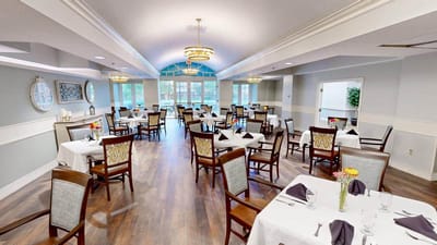 Bright dining room with elegantly set tables