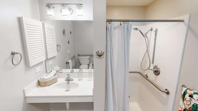 Bright and clean bathroom with safety features.