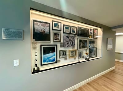 Display of framed space-related photographs and artifacts