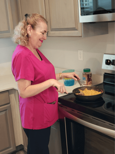 Staff member cooking in a modern kitchen