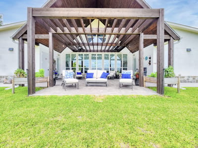 Outdoor seating area with loungers and plants