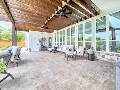Outdoor shaded seating area with lounge chairs