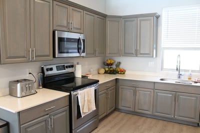 Modern kitchen with appliances and fruit display