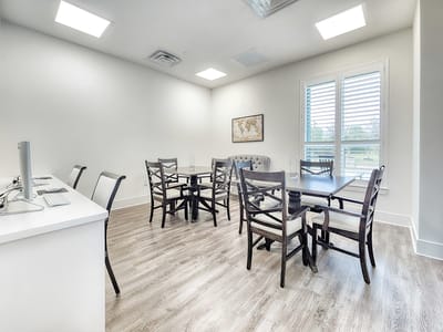 Bright common area with tables and chairs