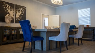 Bright common area with a table and chairs