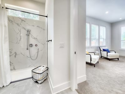 Bright interior view of a resident bathroom and living area