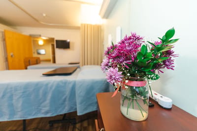Interior view of a resident's room with flowers