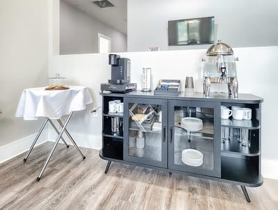 Coffee station with pastries in a lobby area