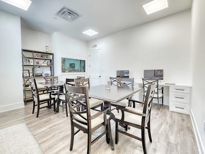 Bright common area with seating and computers