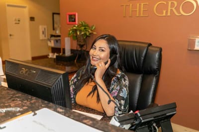 Receptionist at the front desk of The Grove Care and Wellness