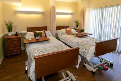 Bright interior of a shared resident room with two beds