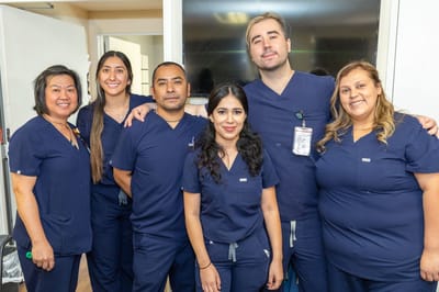 Staff posing together in a common area