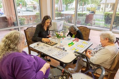Residents playing bingo in a common area