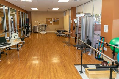 Interior view of a therapy room with exercise equipment
