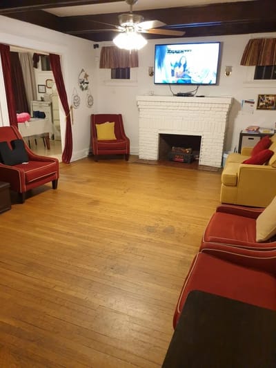 Cozy common area with seating and a TV