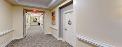 Hallway with artwork and exit signs