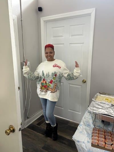 Resident enjoying a festive winter-themed sweater.