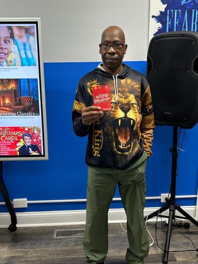 Resident enjoying an activity in a common area.