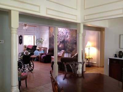 Interior view with residents and seating area.