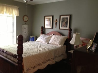 Cozy bedroom with a bed and decorations.