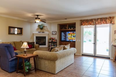 Cozy lounge area with seating and TV.