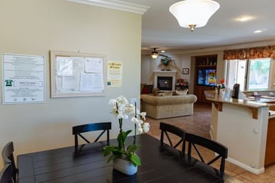 Cozy common area with seating and a plant.